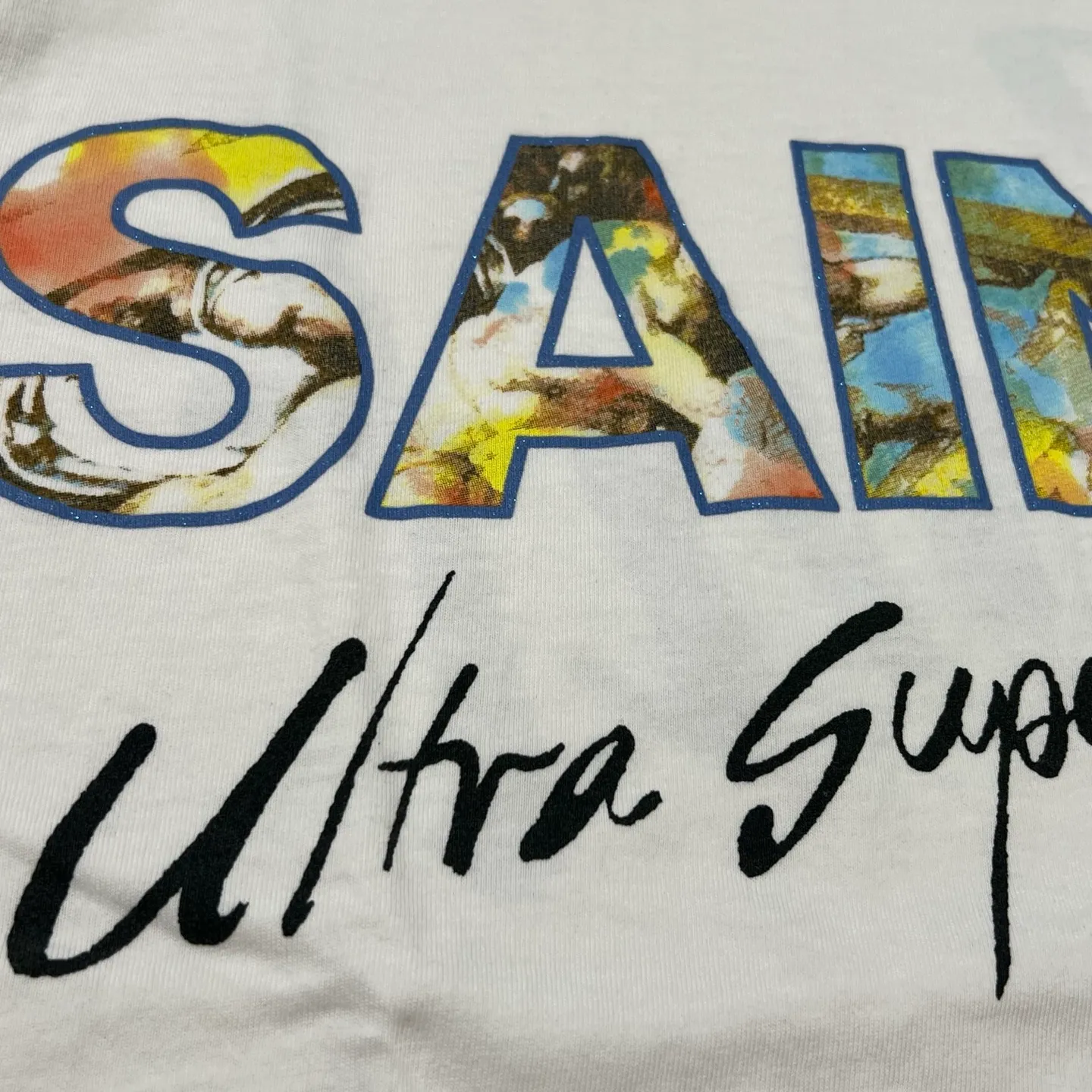 SAINT Mxxxxxx SS TEE/SUPER DIRTY/WHT oil painting SAINT SUPER DIRTY slogan TEE off-white S-XL Made of original OE yarn tube weaving without side seams to distinguish the split fabrics original consistent VINTAGE label/little angel anti-counterfeiting label top printing technology highly restored original details